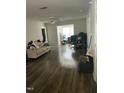 Bright living room features wood-look flooring and a ceiling fan at 3000 Centennial Woods Dr # 302, Raleigh, NC 27603