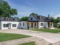 Attractive two-story home with a long driveway and meticulously maintained landscaping at 316 Barbour St, Clayton, NC 27520