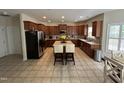 Well-equipped kitchen featuring custom cabinets, a central island, and modern appliances for the home chef at 3713 Coach Lantern Ave Ave, Wake Forest, NC 27587