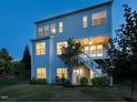 Rear exterior featuring a spacious yard, a private walk-out basement, stairs to a deck, and ample natural light at 437 Henmore Brook Dr Dr, Cary, NC 27519