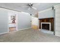 Spacious living area with a fireplace, built-ins, and a view into the kitchen at 712 Beaver Dam Rd, Raleigh, NC 27607