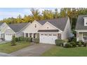 Lovely home showcasing a manicured front lawn and a convenient two-car garage at 80 Bramble Ln, Clayton, NC 27527
