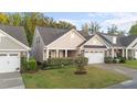 Beautiful one-story home with a well-maintained lawn and a two-car garage at 80 Bramble Ln, Clayton, NC 27527
