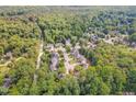 Aerial shot of the neighborhood showcasing lush trees and well-maintained properties at 8816 Valley Springs Pl, Raleigh, NC 27615