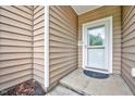 Close-up of the front door area displaying the exterior siding at 921 Shefford Town Dr, Rolesville, NC 27571