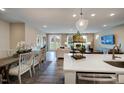Spacious open-concept area combining kitchen, dining, and living room for modern living at 1033 Masters Place Way # 110, Durham, NC 27703