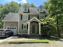 Charming two-story home with a traditional design, dormer windows, and a covered front porch at 110 Ruth St, Carrboro, NC 27510
