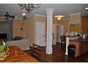Open-concept space featuring hardwood floors, neutral paint, and seamless flow to dining area at 110 Ruth St, Carrboro, NC 27510