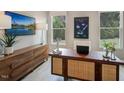 Well-lit home office with wood desk, modern decor, large windows, and ample storage space at 1107 Masters Place Way # 155, Durham, NC 27703