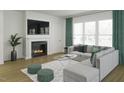 Bright living room with a fireplace, large windows, and comfortable gray seating area at 1207 Masters Place Way # 184, Durham, NC 27703
