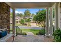 Covered front porch offering neighborhood views with stone columns and classic railings at 1420 Heritage Links Dr, Wake Forest, NC 27587