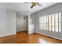 Spacious living room featuring hardwood floors, neutral paint, and a window with wooden blinds at 18 Gwendolyn Cir, Durham, NC 27703
