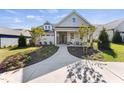 Charming single-Gathering home with inviting front porch, manicured landscaping, and well-lit entrance at 2006 Kapalua Way # 190, Durham, NC 27703