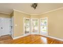 Inviting living room with ample natural light and hardwood floors, ideal for relaxing or entertaining at 2617 Charenson Pl, Raleigh, NC 27614