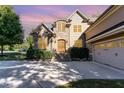 Beautiful home with stone accents, a spacious driveway, and a manicured lawn at 268 The Preserve Trl, Chapel Hill, NC 27517
