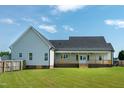 Large backyard with a covered porch, perfect for outdoor relaxation and entertaining at 3417 Aspen Rd, Rocky Mount, NC 27804