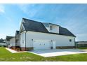 Spacious side-entry two-car garage and a driveway offer plenty of parking space at 3417 Aspen Rd, Rocky Mount, NC 27804