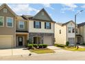 Attractive two-story townhouse with well-kept landscaping and attached single-car garage at 5031 Eagle Stone Ln, Raleigh, NC 27610