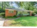 Quaint brick duplex with a shared front porch and charming curb appeal at 603 Kildaire Farm Road Rd, Cary, NC 27511