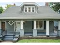 Close-up of home showcasing a welcoming covered front porch and freshly painted exterior at 612 Dunbar St, Durham, NC 27701