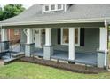Close-up view of the porch area on a freshly painted craftsman style home at 612 Dunbar St, Durham, NC 27701