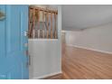 Inviting foyer with hardwood floors and staircase leading to the upper level at 7024 Beaverwood Dr, Raleigh, NC 27616
