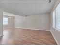 Spacious living room with wood flooring and ample natural light at 7024 Beaverwood Dr, Raleigh, NC 27616