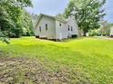 Expansive backyard with lush green grass surrounding the house at 1000 Roundtable Ct, Knightdale, NC 27545