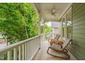 Cozy front porch featuring comfortable chairs and scenic views, ideal for enjoying outdoor relaxation and entertaining guests at 102 Newell St, Chapel Hill, NC 27516