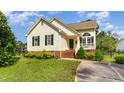 Charming one-story home with vinyl siding, green shutters and a well-manicured front yard at 1211 Azalea Dr, Zebulon, NC 27597