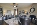 Inviting living room with neutral paint, fireplace, ceiling fan, stylish decor, and coordinated furnishings at 1249 Turkey Trot Rd, Wendell, NC 27591