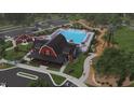 Community clubhouse with pool, walking path, and windmill at 13 Cozy Hvn, Fuquay Varina, NC 27526