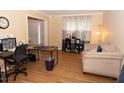 Brightly-lit living room with hardwood floors and a comfortable seating area at 1333 Beaufort Dr, Graham, NC 27253