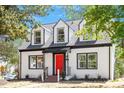 Beautiful two-story home with dormer windows, a red door, and manicured front lawn at 134 Nelson St, Durham, NC 27707