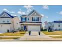 Charming two-story home featuring a two-car garage and stone accents at 160 N Finley Landing Pkwy, Smithfield, NC 27577