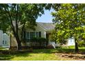 A cozy single-Gathering home with nice landscaping and a charming front porch welcomes you to a serene neighborhood at 200 Steeple Rd, Holly Springs, NC 27540