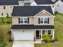 Aerial view of a lovely neighborhood featuring manicured lawns and well-maintained homes in a cul-de-sac at 209 White Farm Dr, Wendell, NC 27591