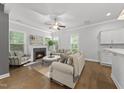 Inviting living room with a fireplace, hardwood floors, and plenty of natural light at 359 Ashton Ridge Ln, Cary, NC 27513