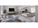 Inviting living room featuring a fireplace, stylish furnishings, and neutral decor for a cozy atmosphere at 3700 Summer Pl, Raleigh, NC 27604