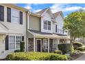 Attractive townhome with stone accents and well-maintained shrubbery at 3806 Bison Hill Ln, Raleigh, NC 27604