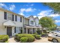 A street view of inviting townhomes, featuring lush front yard landscaping at 3806 Bison Hill Ln, Raleigh, NC 27604