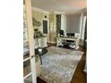 Bright home office with bay window, desk, neutral walls, and decorative accents at 404 Versailles Dr, Cary, NC 27511