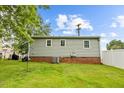 Home's backyard has a well-maintained lawn area and privacy fence at 4048 B S Nc 62 Hwy, Burlington, NC 27215