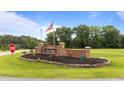 Brick 'Blaze Ridge' community sign features professional landscaping, an American flag, and neighborhood welcome at 46 Blaze Ridge Dr, Smithfield, NC 27577