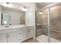 Bathroom featuring double vanity and large glass enclosed shower with decorative tile at 501 Hazy Hills Ln, Garner, NC 27529