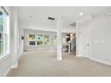 Bright living room with neutral carpet and paint, and an open layout at 635 Black Angus Dr, Haw River, NC 27258
