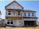 New construction home featuring a two-story facade and attached two-car garage at 682 Old Station Pointe, Angier, NC 27501