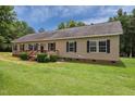 Charming home featuring a wheelchair ramp, manicured bushes and dark shutters at 921 Sweet Raspberry Lane Ln, Lillington, NC 27546