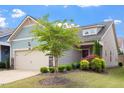 Beautiful home with well-maintained lawn and landscaping in a suburban neighborhood at 1008 Sounding Ln, Durham, NC 27703