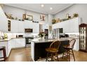 Bright kitchen features stainless appliances, granite counters, and a functional center island at 115 Thornwhistle Pl, Garner, NC 27529